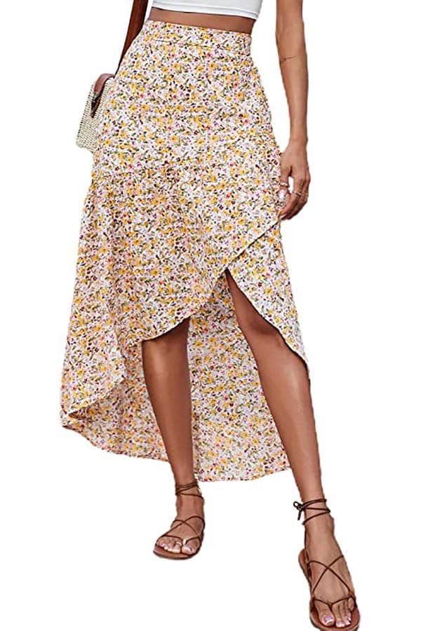 Close up of model wearing floral skirt with high-low hemline.