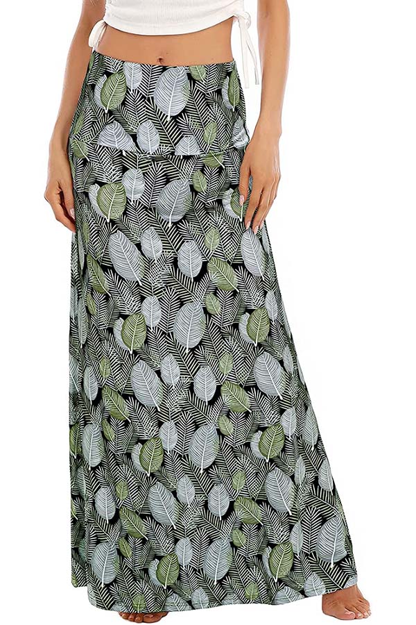Close up of model wearing maxi skirt with leaf pattern.