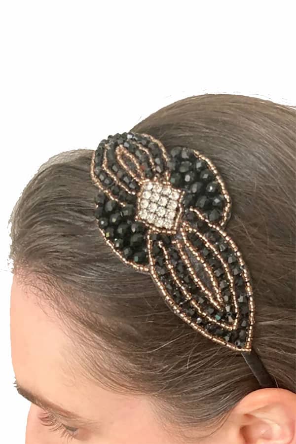 Retro Fashion: 10 Budget-Friendly Accessories + Essential Style Tips 1 Close up of retro beaded headband in woman's hair.