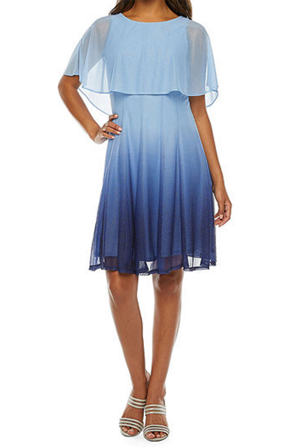 A model wearing a blue ombre fit and flare dress.