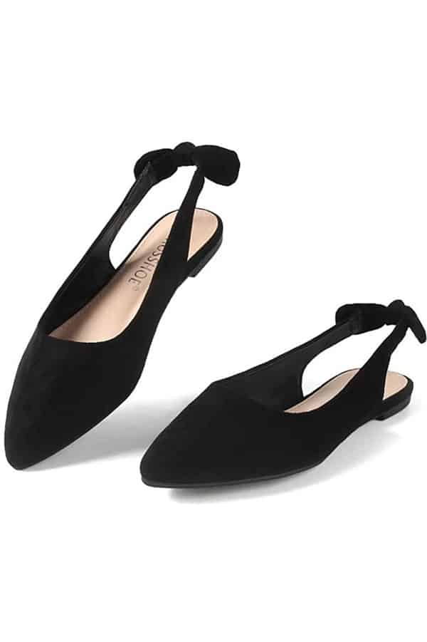 Black slingback flat-soled shoes on white background.