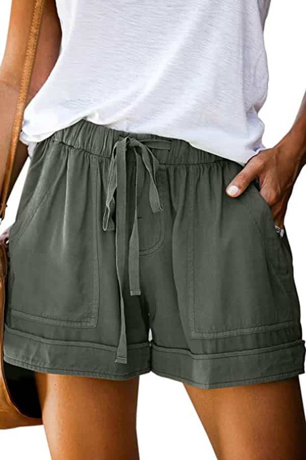 A close-up of a model wearing shorts with a short tie and waist.