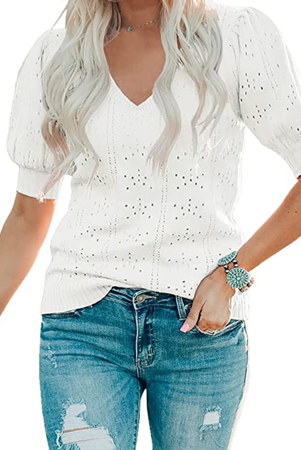 Model wearing short-sleeved sweater.