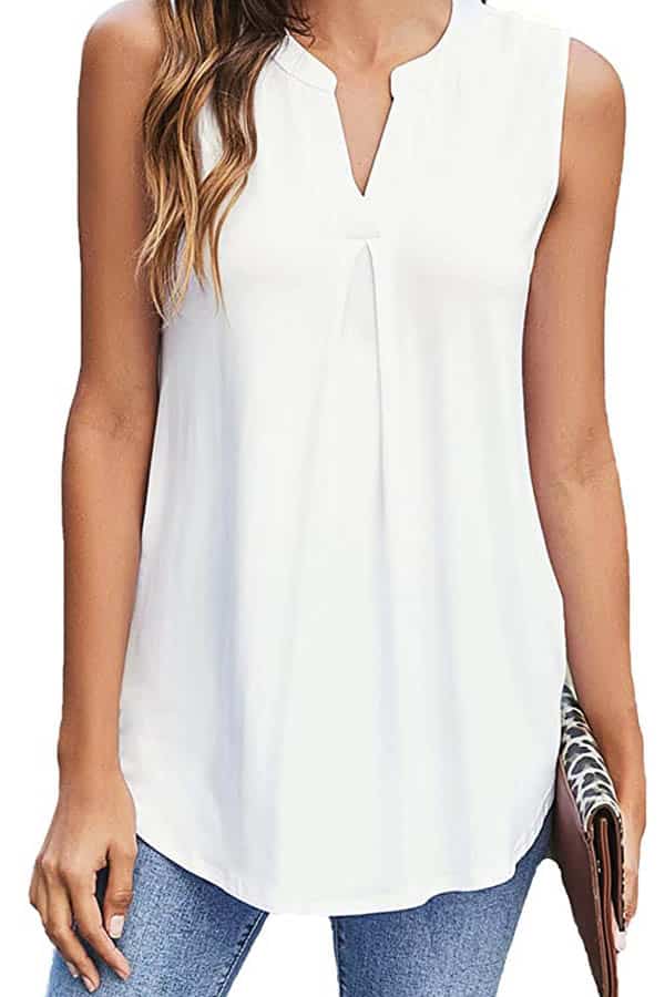 Close-up of model wearing white shell top for summer outfits.