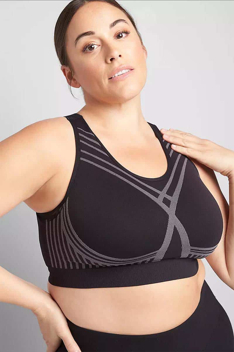 Model wearing black and grey plus size sports bra.