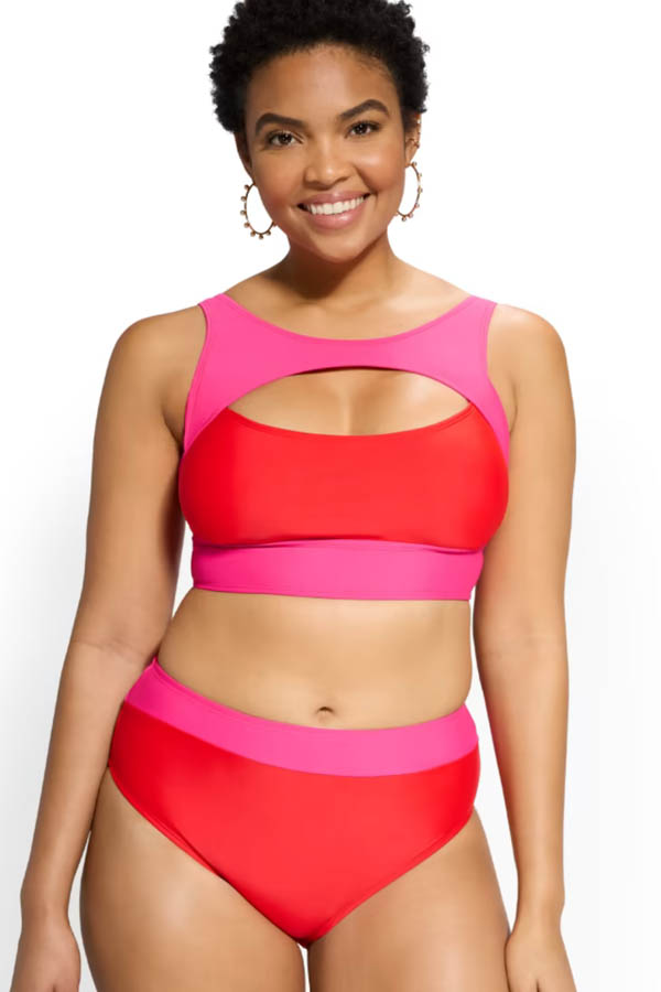 Smiling model wears colorblocked swimsuit by New York & Company.