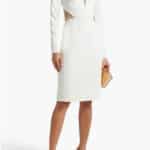 How to Wear the Sheer Trend When You're 40+ 3 Model wears white dress with sheer panels.