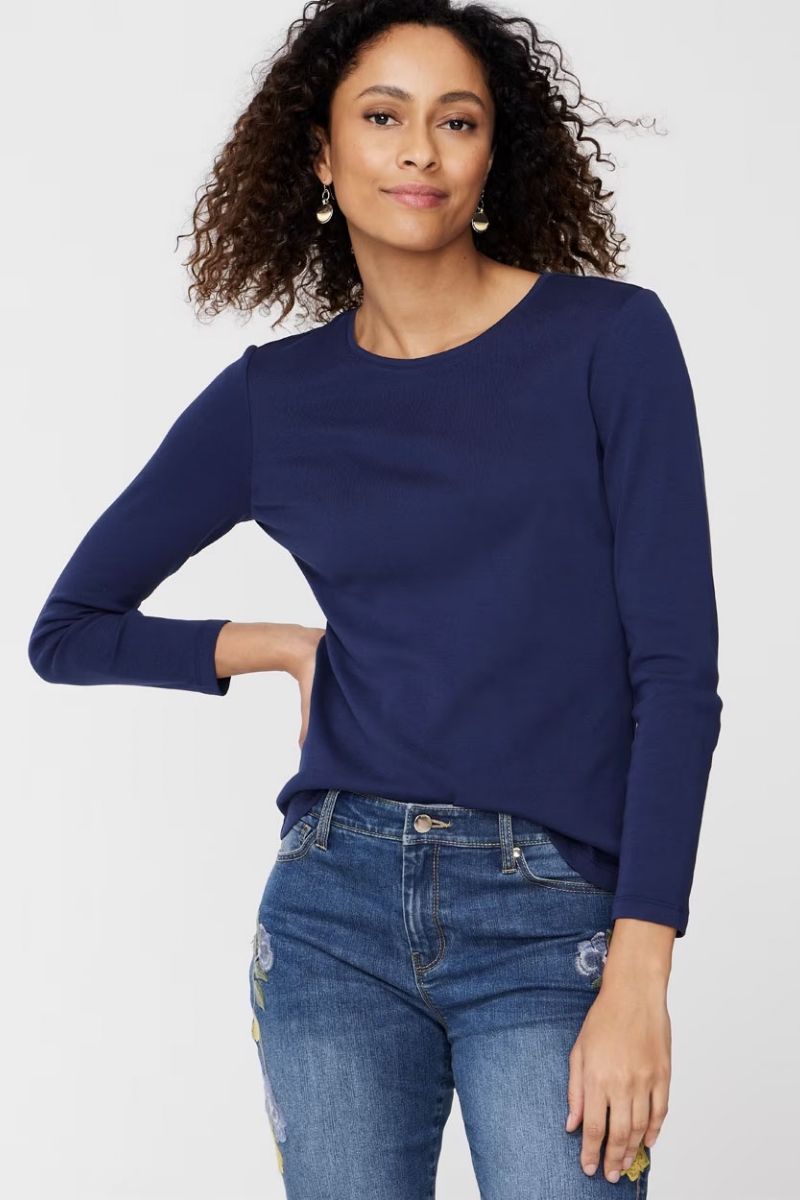Fall Clothing Checklist: 9 Trendy Pieces You Need 2 Model wears navy scoop neck t-shirt, part of our fall clothing checklist.