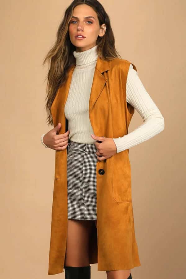 Model wears camel vest from Lulus.