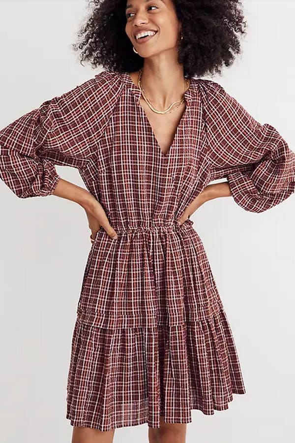 Model wears Madewell seersucker dress on sale for Labor Day.
