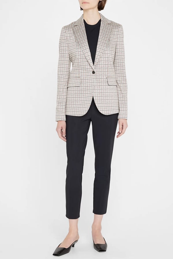 Model wears equestrian blazer from Bergdorf Goodman.