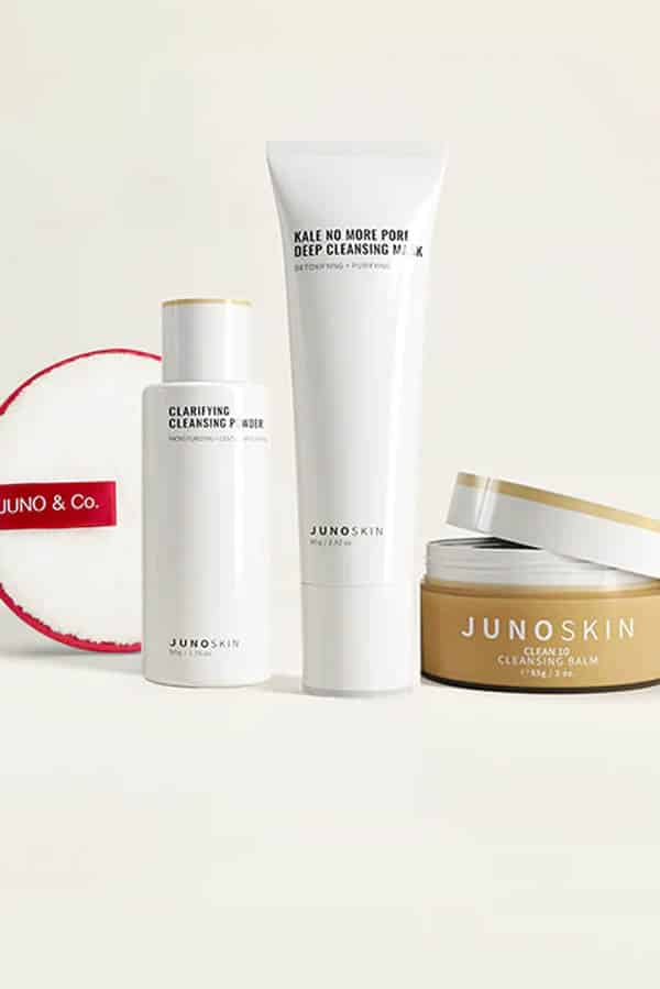 Junoco skincare set on beige background.