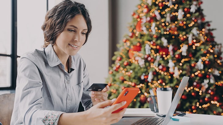 Woman shops online for holiday gifts.