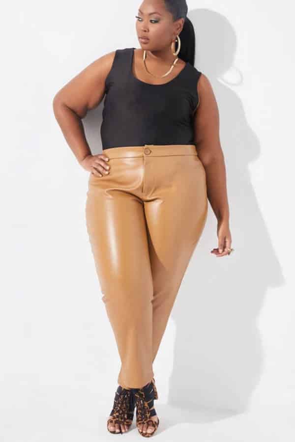 Model wears faux leather skinny pants from Ashley Stewart. 