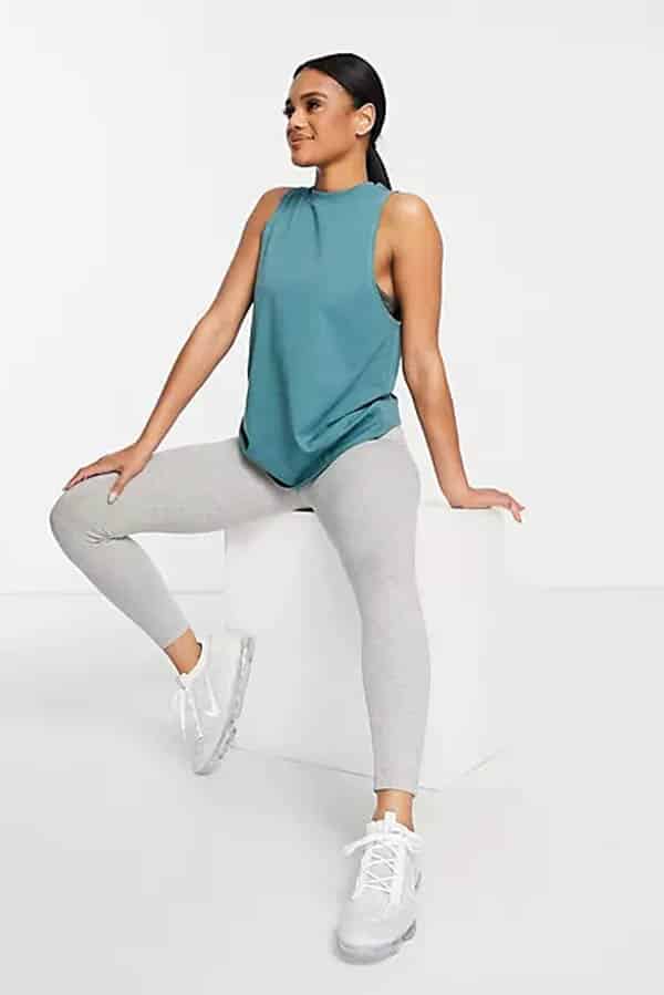 Model wearing workout tank top and pants from ASOS.