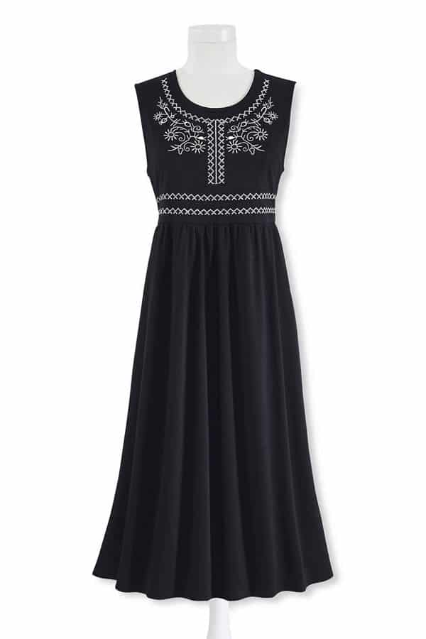Embroidered dress from plus-size clothing store Serengeti against white background.