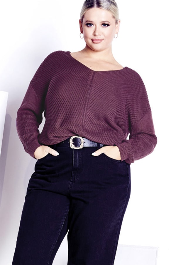 Woman wearing plus-size sweater from Avenue.