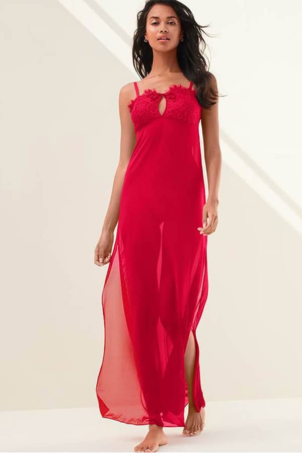 Model wears long, red, sheer nightgown as Valentine's lingerie.