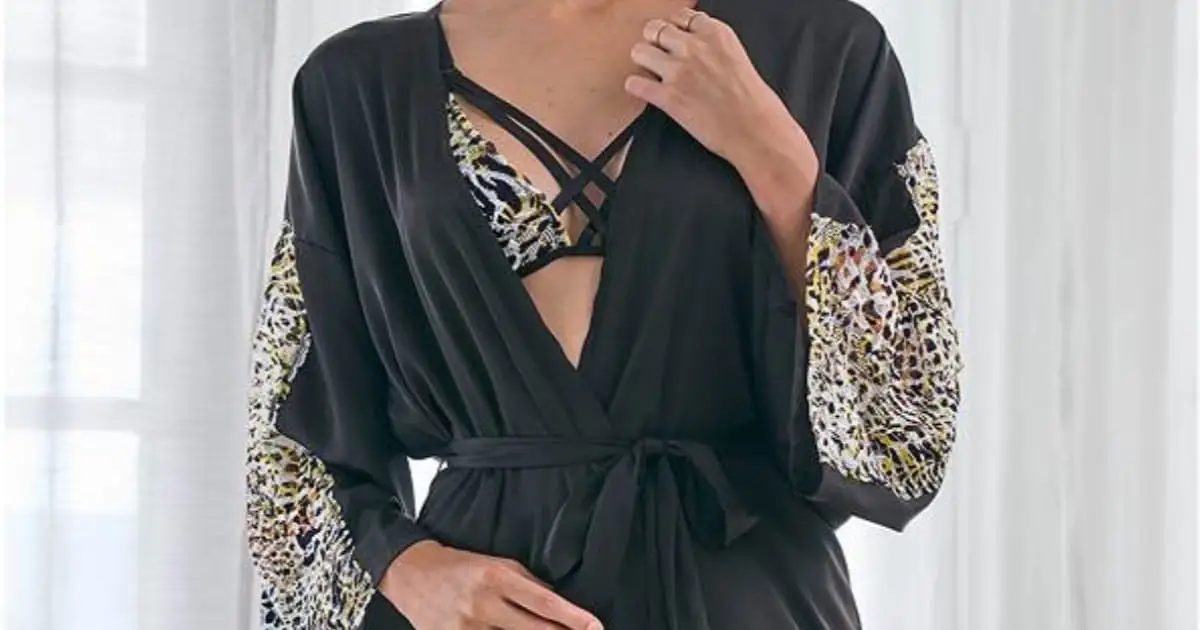 Model wearing sexy robe with animal print detail.