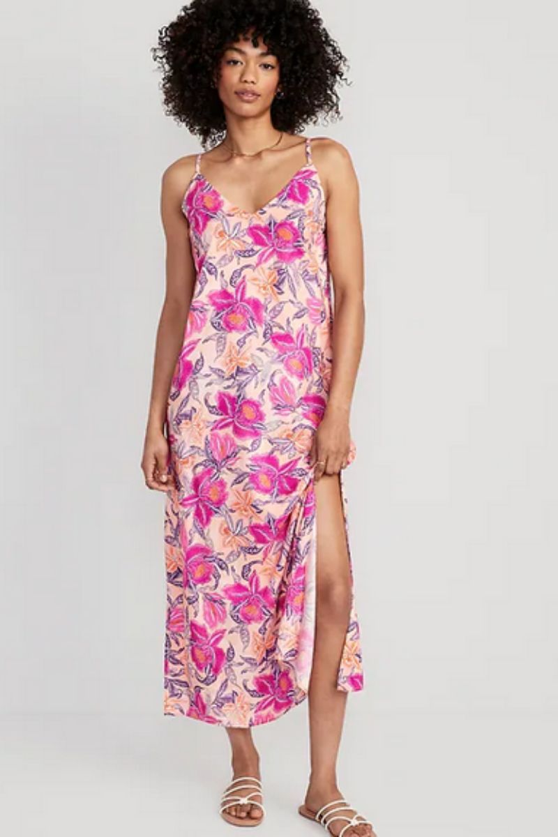 Model wears floral pink maxi dress, part of the Old Navy summer clothes collection.