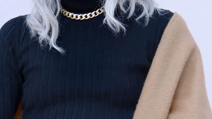 Close up of woman wearing fall outfit.