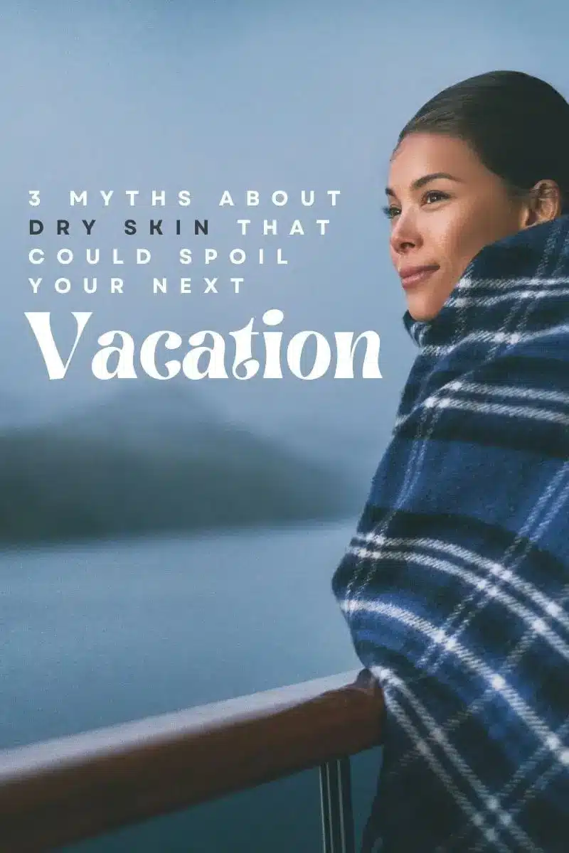 3 Dry Skin Myths That Could Spoil Your Next Vacation 1 Woman standing on cruise ship deck wrapped in blanket to represent dry skin and travel.