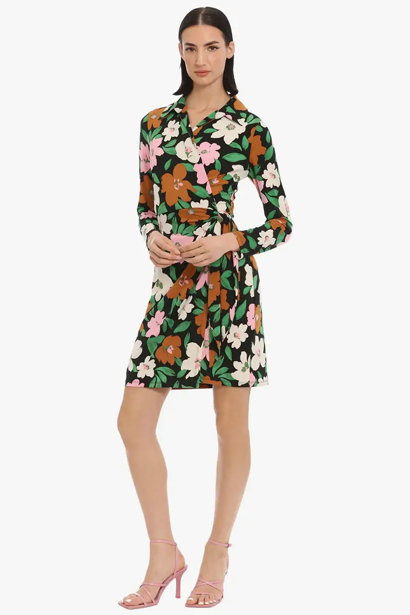 Model wears floral dress against white background.