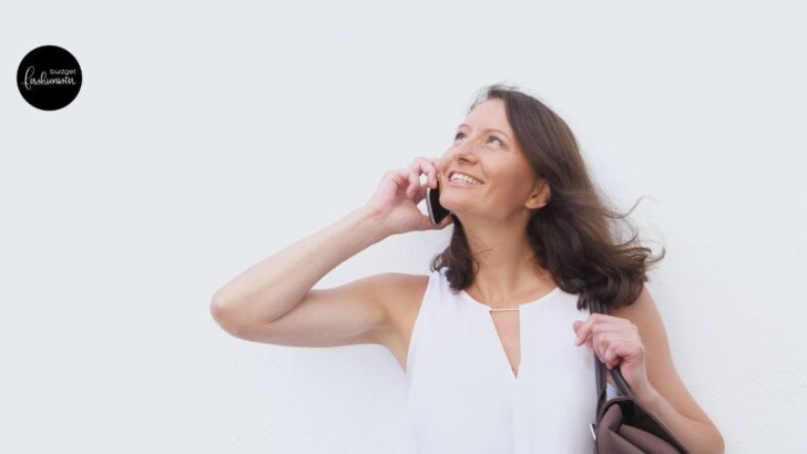 Woman looking up while talking on cell phone.