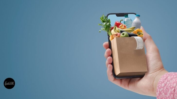 Online shopping concept -- mobile phone with a small bag of groceries.