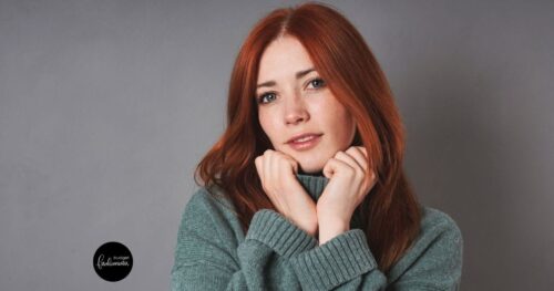 Woman wearing green turtleneck.