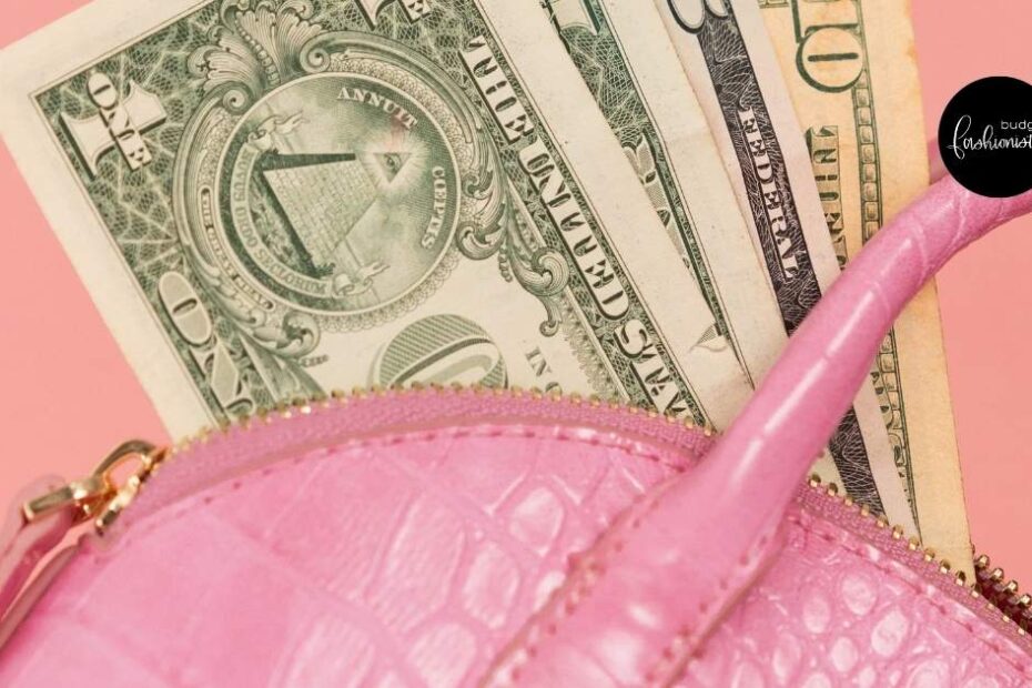 Pink purse with dollar bills inside.