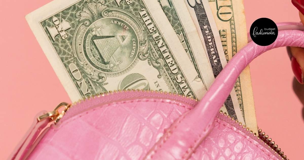 Pink purse with dollar bills inside.