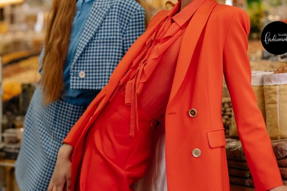 Close-up view of fashionable woman wearing tomato-red outfit.