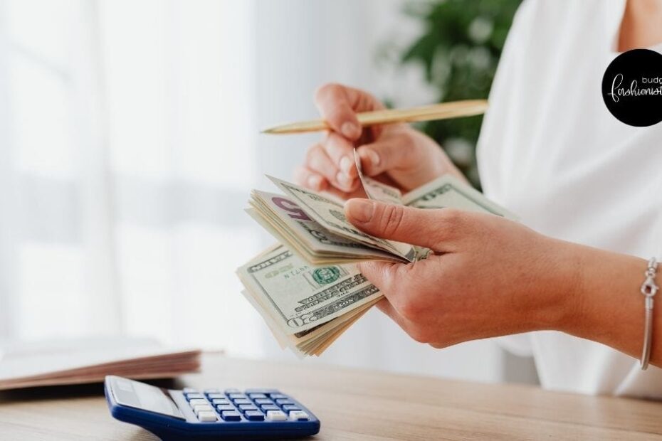 female hands holding money as if learning how to budget
