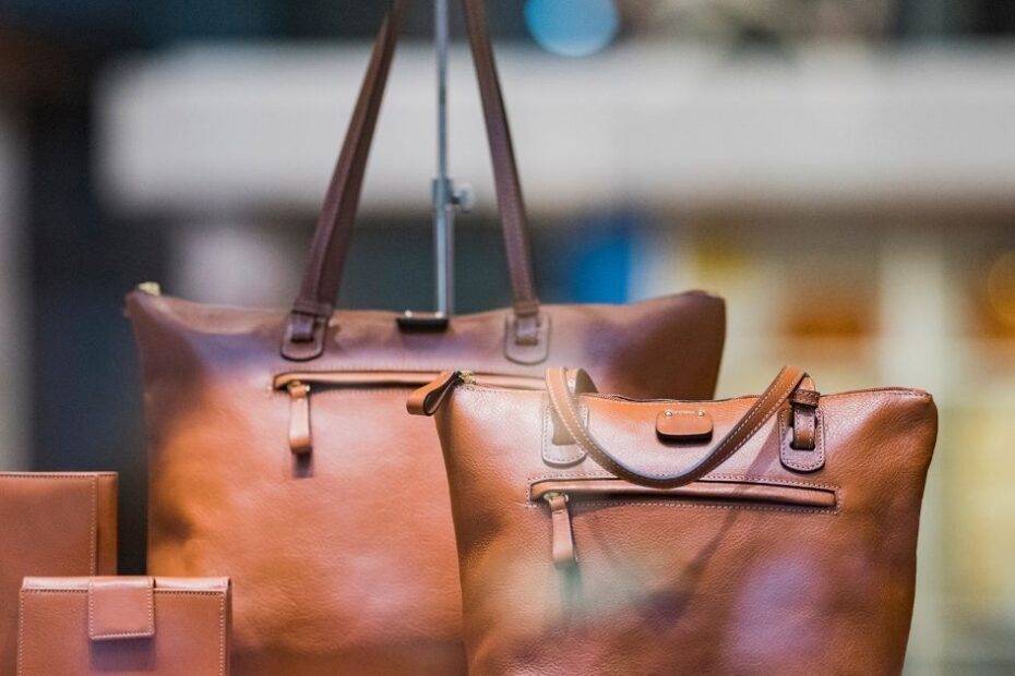 leather handbags on table