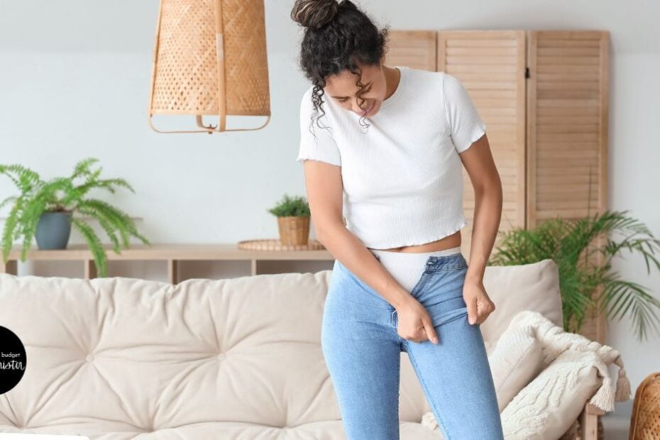 Woman tries on pants that are too small