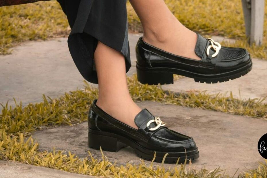 Close up of woman wearing platform loafers