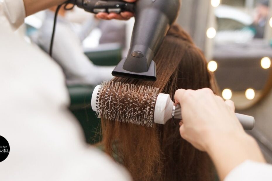 Stylist drying hair with a concentrator nozzle