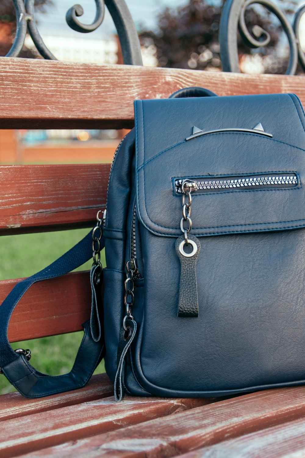 Bag rut? 7 handbags that work as hard as your go-to crossbody 2 Black leather convertible fashion backpack on bench