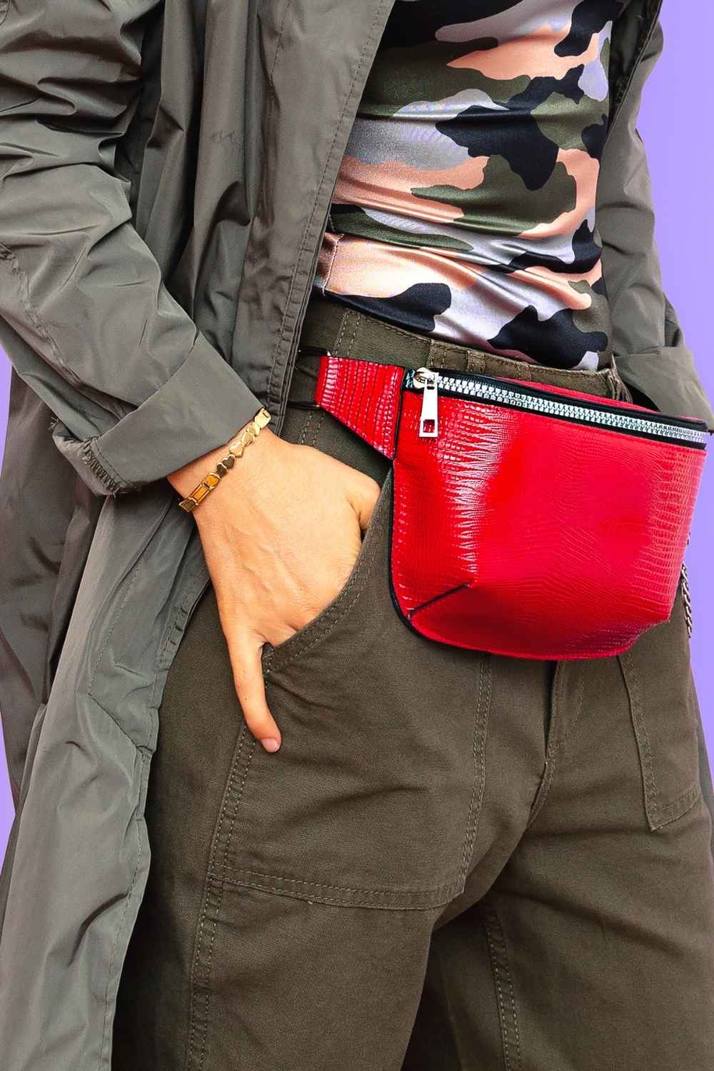 Bag rut? 7 handbags that work as hard as your go-to crossbody 6 Close up of woman wearing bright red belt bag
