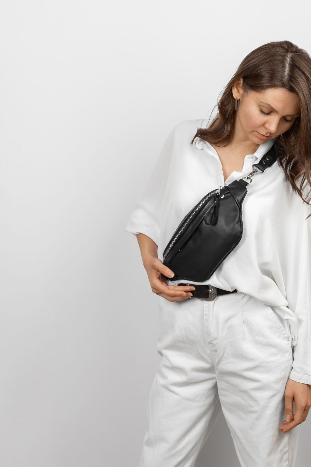 Bag rut? 7 handbags that work as hard as your go-to crossbody 3 Woman wearing utility chest sling bag